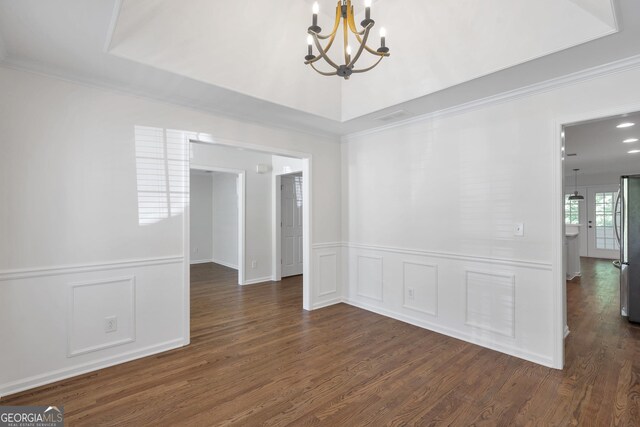 5523 River Valley Way, Flowery Branch, GA 30542 - unfurnished room featuring a chandelier, crown molding, dark wood finished floors, a decorative wall, and a wainscoted wall