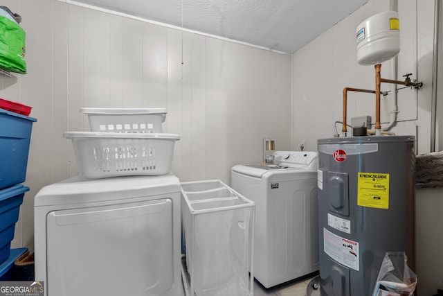 1322 Melford Dr, Columbus, GA 31907 - laundry room with water heater, washing machine and clothes dryer, and a textured ceiling