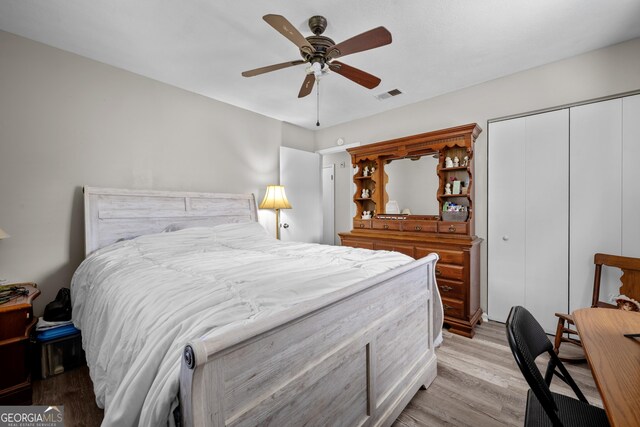 1322 Melford Dr, Columbus, GA 31907 - bedroom with light wood finished floors, a closet, and a ceiling fan