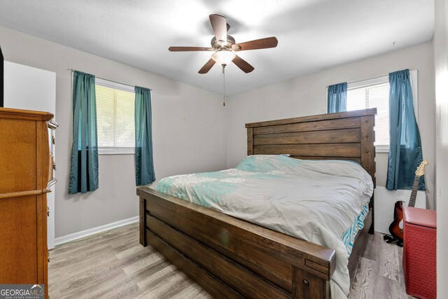 1322 Melford Dr, Columbus, GA 31907 - bedroom with light wood finished floors, baseboards, and a ceiling fan