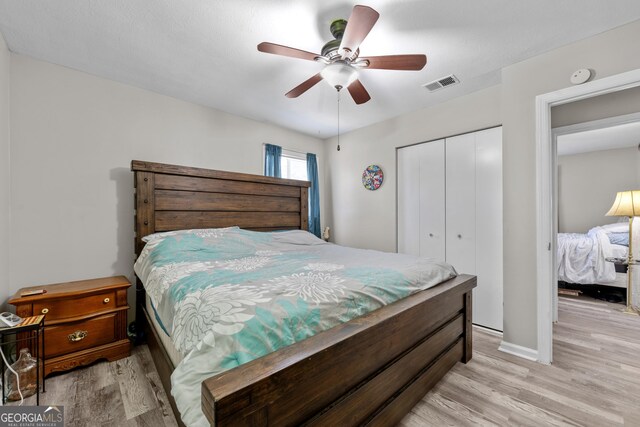 1322 Melford Dr, Columbus, GA 31907 - bedroom with light wood-style floors, a closet, a ceiling fan, and baseboards