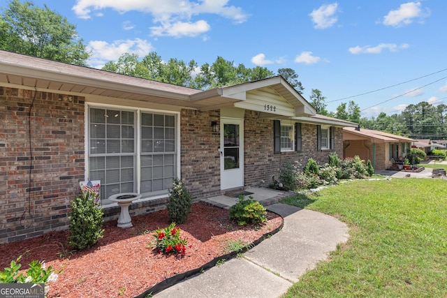 1322 Melford Dr, Columbus, GA 31907 - view of front of home with a front lawn and brick siding