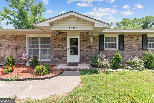 1322 Melford Dr, Columbus, GA 31907 - ranch-style home featuring brick siding and a front lawn