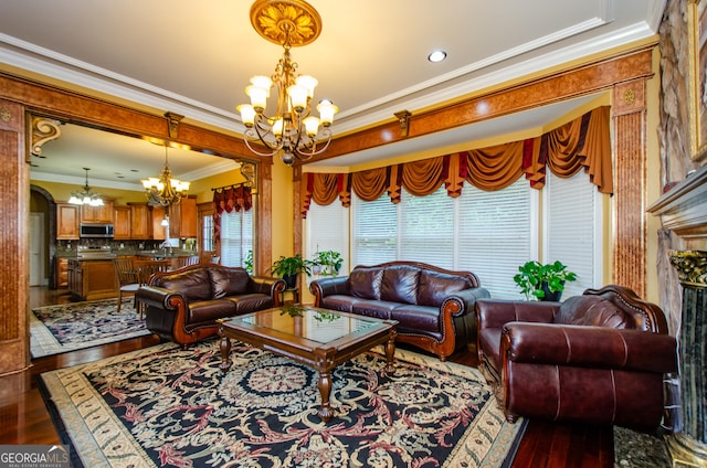 2120 Shaffer Rd, Cumming, GA 30041 - living area featuring a chandelier, dark wood-type flooring, ornamental molding, and arched walkways