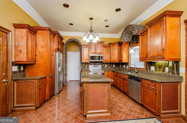 2120 Shaffer Rd, Cumming, GA 30041 - kitchen featuring appliances with stainless steel finishes, a sink, backsplash, brown cabinetry, and a kitchen island