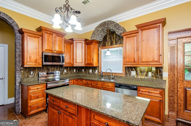 2120 Shaffer Rd, Cumming, GA 30041 - kitchen with appliances with stainless steel finishes, a chandelier, plenty of natural light, backsplash, and ornamental molding