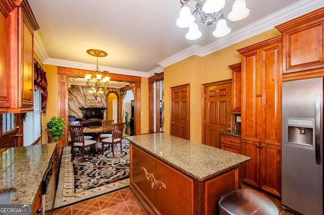 2120 Shaffer Rd, Cumming, GA 30041 - kitchen with stainless steel fridge, a chandelier, a center island, light stone countertops, and ornamental molding