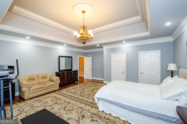 2120 Shaffer Rd, Cumming, GA 30041 - bedroom featuring a tray ceiling, a chandelier, wood finished floors, crown molding, and recessed lighting