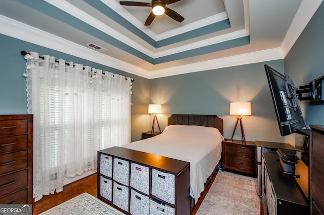 2120 Shaffer Rd, Cumming, GA 30041 - bedroom featuring a raised ceiling, wood finished floors, ornamental molding, ceiling fan, and an office area