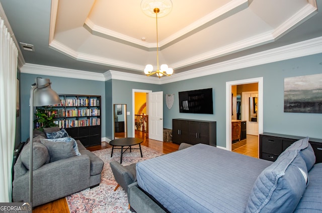 2120 Shaffer Rd, Cumming, GA 30041 - bedroom with a raised ceiling, crown molding, a chandelier, and wood finished floors