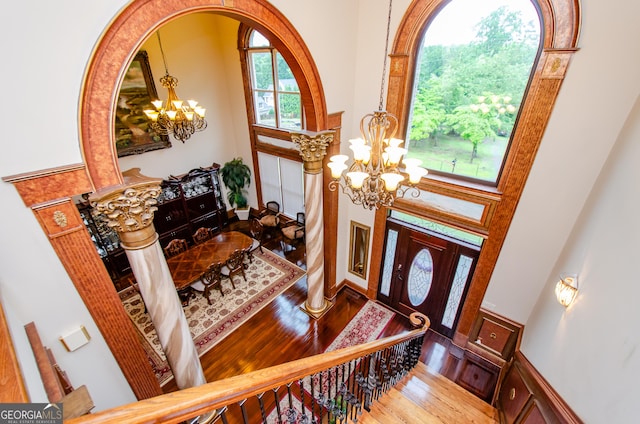 2120 Shaffer Rd, Cumming, GA 30041 - foyer entrance with a chandelier, a towering ceiling, and wood finished floors