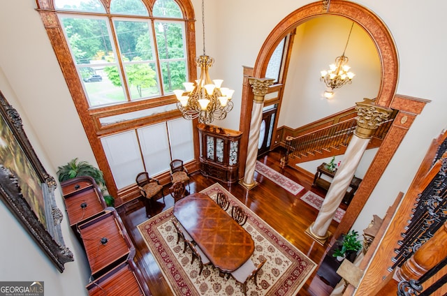 2120 Shaffer Rd, Cumming, GA 30041 - living area featuring a chandelier, stairway, wood finished floors, and a high ceiling