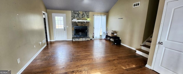 2816 Quinbery Dr, Snellville, GA 30039 - living area featuring hardwood / wood-style floors, lofted ceiling, stairs, a fireplace, and baseboards