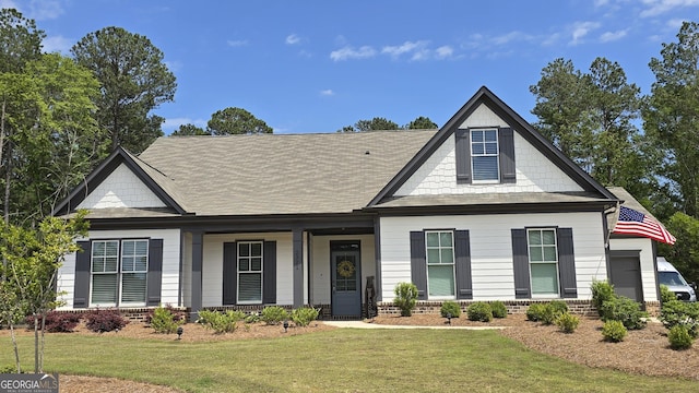 2321 Margaux Ct, Monroe, GA 30656 - view of front facade with a front yard, brick siding, and a porch