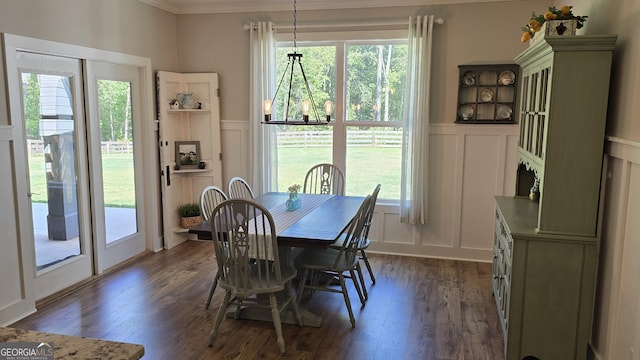 2321 Margaux Ct, Monroe, GA 30656 - dining space with a decorative wall, dark wood-style floors, crown molding, and a wainscoted wall