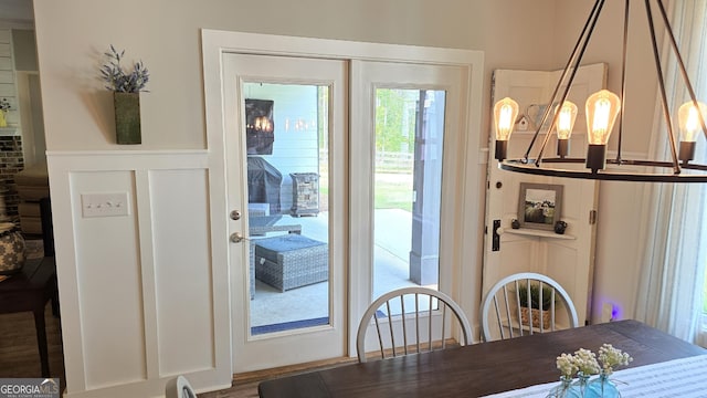 2321 Margaux Ct, Monroe, GA 30656 - dining area featuring a chandelier and a wainscoted wall