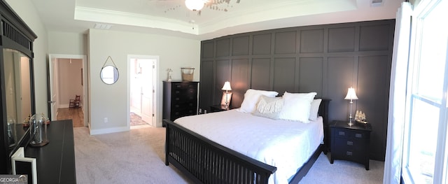 2321 Margaux Ct, Monroe, GA 30656 - bedroom with light carpet, ornamental molding, a tray ceiling, and connected bathroom