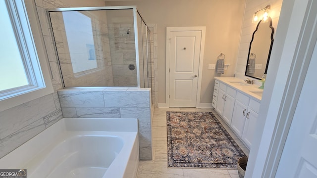 2321 Margaux Ct, Monroe, GA 30656 - bathroom with a garden tub, vanity, tiled shower, marble finish floors, and baseboards