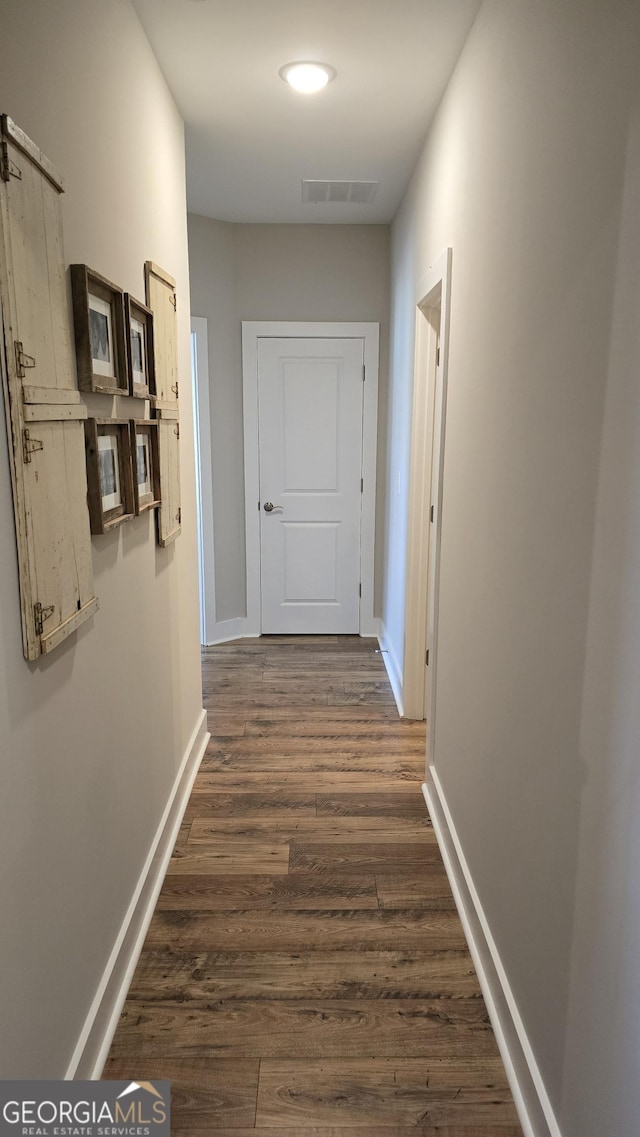 2321 Margaux Ct, Monroe, GA 30656 - corridor featuring dark wood finished floors and baseboards