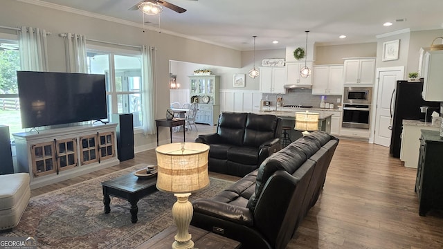 2321 Margaux Ct, Monroe, GA 30656 - living area with a ceiling fan, ornamental molding, wood finished floors, and recessed lighting