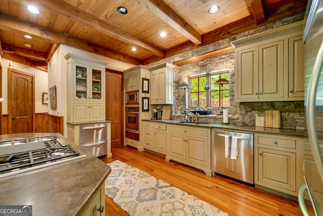 4334 Murray Cove Rd, Tiger, GA 30576 - kitchen featuring appliances with stainless steel finishes, wooden ceiling with exposed beams, a warming drawer, light wood-style floors, and dark countertops