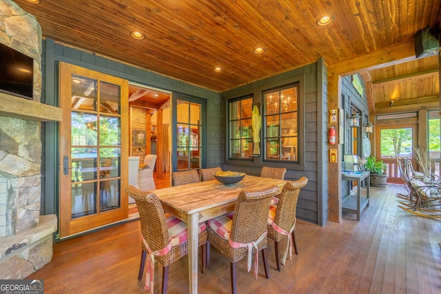 4334 Murray Cove Rd, Tiger, GA 30576 - dining area featuring wood ceiling, hardwood / wood-style floors, wood walls, recessed lighting, and a fireplace