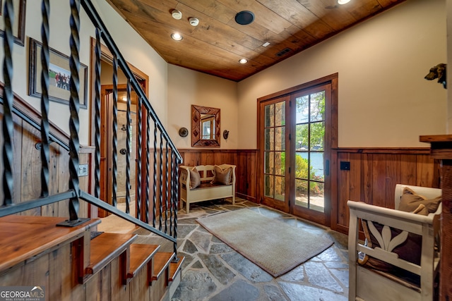 4334 Murray Cove Rd, Tiger, GA 30576 - entrance foyer with wainscoting, stone tile floors, wood ceiling, stairway, and recessed lighting