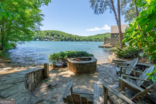 4334 Murray Cove Rd, Tiger, GA 30576 - view of patio / terrace featuring a fire pit, a water view, and a view of trees