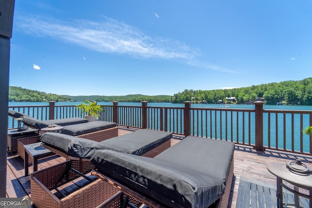 4334 Murray Cove Rd, Tiger, GA 30576 - wooden deck featuring an outdoor hangout area, a wooded view, and a water view