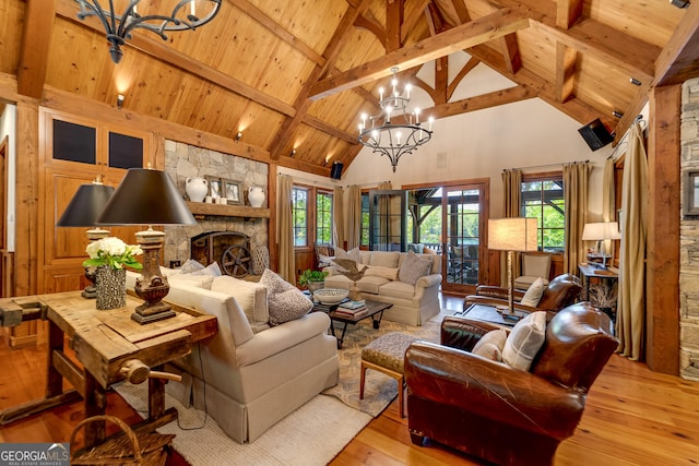 4334 Murray Cove Rd, Tiger, GA 30576 - living area featuring a chandelier, high vaulted ceiling, light wood-style floors, wood ceiling with exposed beams, and a fireplace