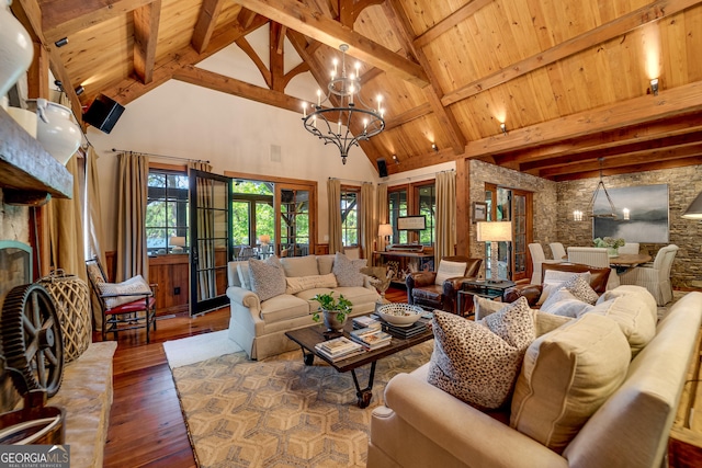 4334 Murray Cove Rd, Tiger, GA 30576 - living area featuring a chandelier, high vaulted ceiling, hardwood / wood-style floors, wooden ceiling with exposed beams, and french doors