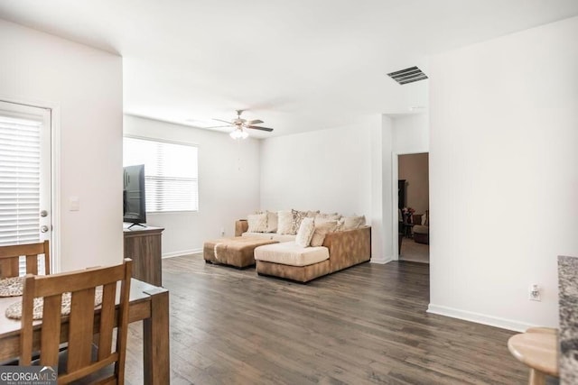 115 Taylor Woods Ct, Bonaire, GA 31005 - living room with a ceiling fan, dark wood-style floors, and baseboards