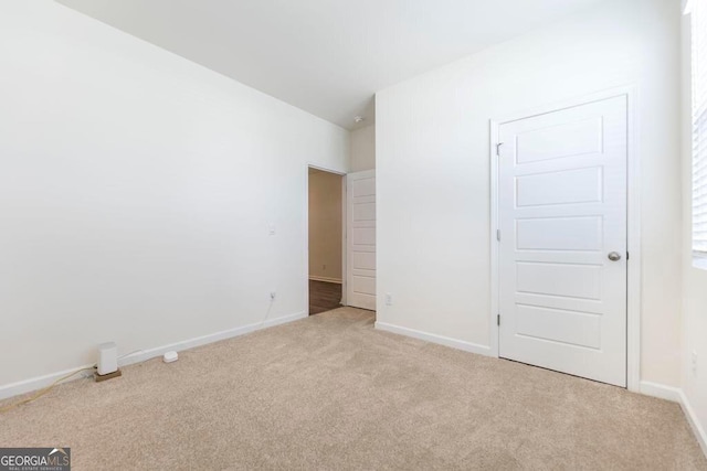 115 Taylor Woods Ct, Bonaire, GA 31005 - unfurnished bedroom with carpet and baseboards