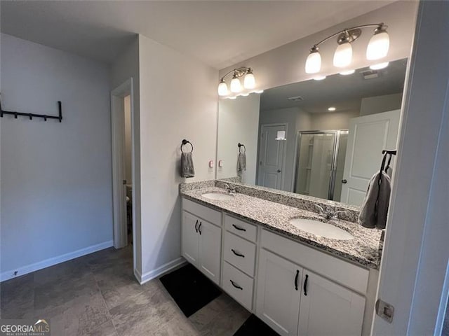 3615 Hawthorne Ter, Atlanta, GA 30337 - bathroom featuring double vanity, a shower stall, and baseboards