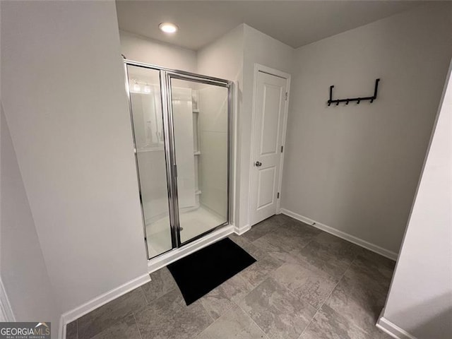 3615 Hawthorne Ter, Atlanta, GA 30337 - bathroom featuring a shower stall, baseboards, and recessed lighting
