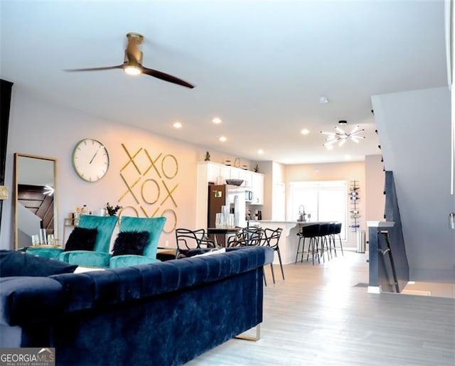 3615 Hawthorne Ter, Atlanta, GA 30337 - living area featuring ceiling fan, light wood finished floors, and recessed lighting