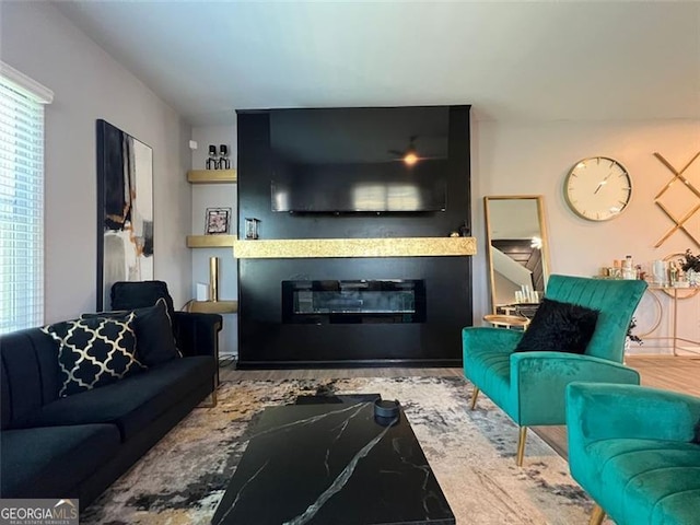 3615 Hawthorne Ter, Atlanta, GA 30337 - living area with a glass covered fireplace and wood finished floors