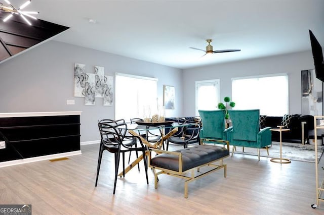 3615 Hawthorne Ter, Atlanta, GA 30337 - dining area with wood finished floors, a ceiling fan, and baseboards