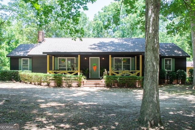 175 Briarwood Cir, Americus, GA 31709 - ranch-style home with a porch, a chimney, and roof with shingles