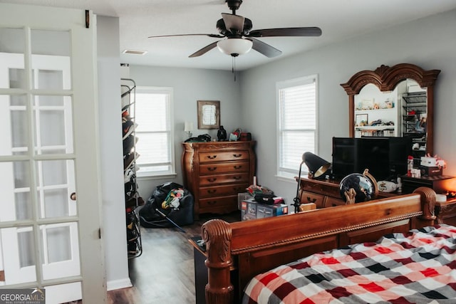 175 Briarwood Cir, Americus, GA 31709 - bedroom with multiple windows, wood finished floors, and ceiling fan