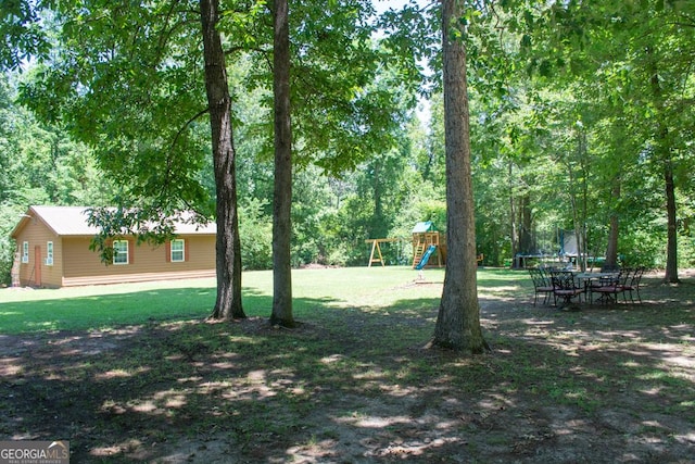 175 Briarwood Cir, Americus, GA 31709 - view of grassy yard featuring a playground