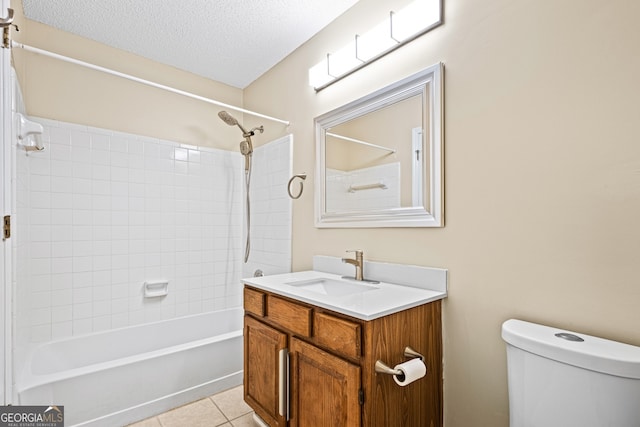 98 Hampshire Ct, Avondale Estates, GA 30002 - full bath featuring vanity,  shower combination, tile patterned flooring, and a textured ceiling