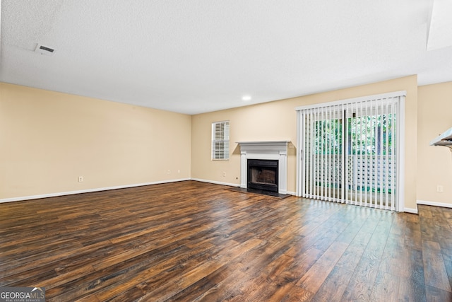 98 Hampshire Ct, Avondale Estates, GA 30002 - unfurnished living room with wood finished floors, a fireplace, and recessed lighting