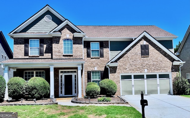 3476 Bridge Walk Dr, Lawrenceville, GA 30044 - view of front of home with driveway, roof with shingles, and brick siding