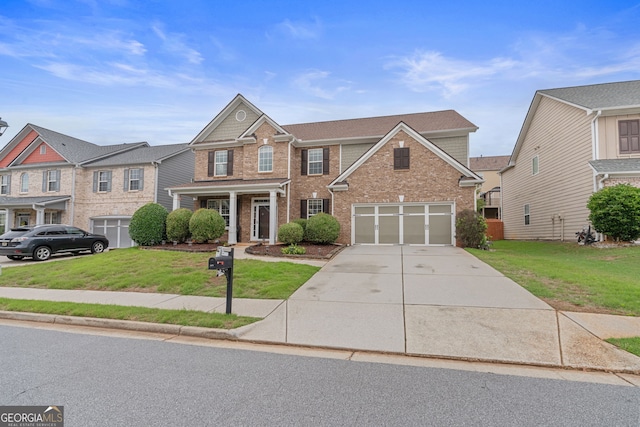 3476 Bridge Walk Dr, Lawrenceville, GA 30044 - view of front of property featuring brick siding, concrete driveway, a front yard, and an attached garage