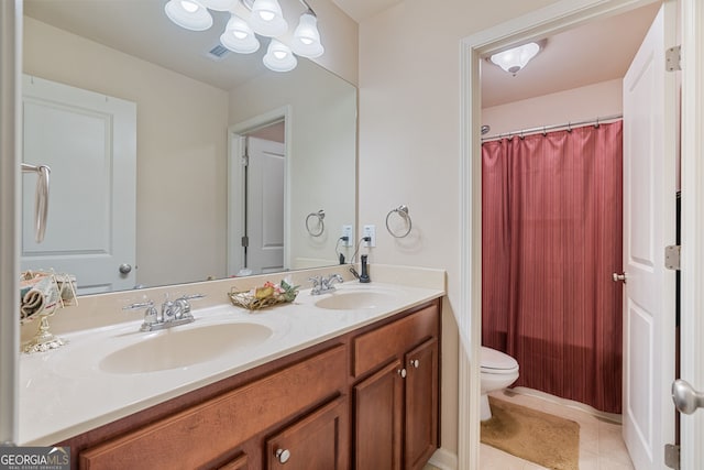 3476 Bridge Walk Dr, Lawrenceville, GA 30044 - bathroom featuring toilet, double vanity, tile patterned floors, and curtained shower