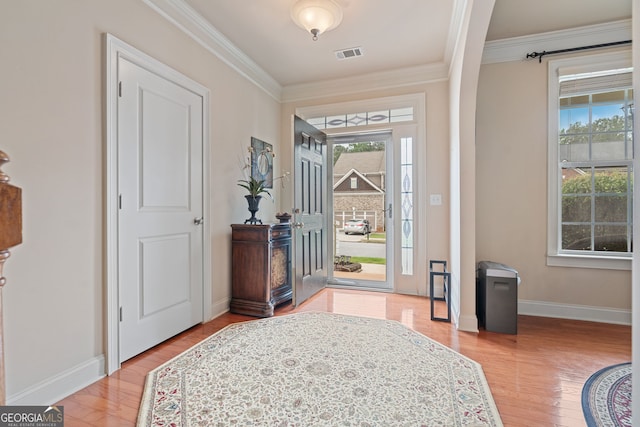 3476 Bridge Walk Dr, Lawrenceville, GA 30044 - foyer with plenty of natural light, light wood finished floors, crown molding, and baseboards