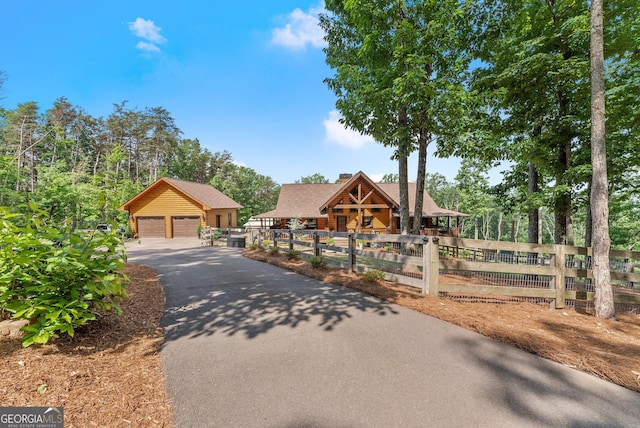 294 Turkey Trl, Jasper, GA 30143 - view of front facade featuring a detached garage, a chimney, and an outdoor structure