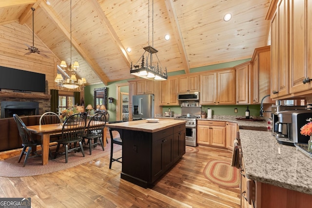 294 Turkey Trl, Jasper, GA 30143 - kitchen featuring high end appliances, butcher block countertops, a sink, light wood-style flooring, and wooden ceiling with exposed beams