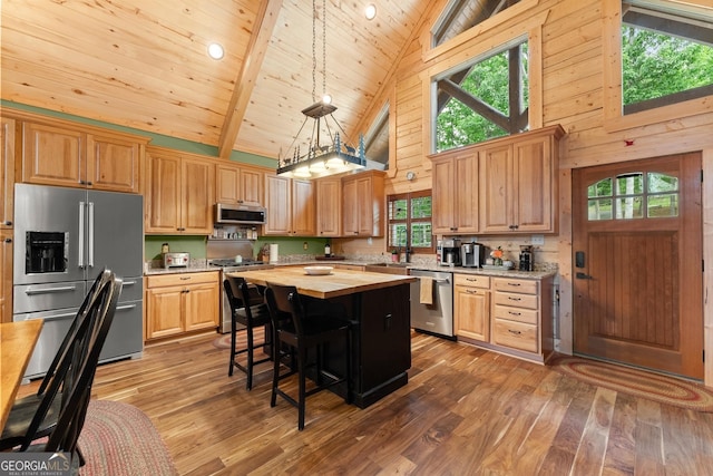 294 Turkey Trl, Jasper, GA 30143 - kitchen featuring appliances with stainless steel finishes, high vaulted ceiling, hardwood / wood-style flooring, a center island, and butcher block countertops
